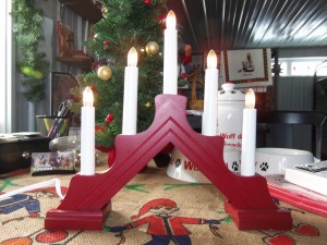 Electric Candle ..nice display in your window...comes with a small wreath around candles....JULE napkins, and more...contac Wuff Da if you're interested...as we only have limited supplies left......